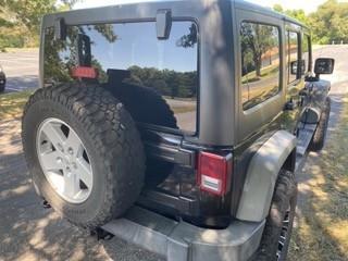 Black 2011 Jeep Wrangler Unlimited Sport