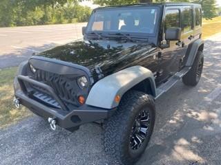 Black 2011 Jeep Wrangler Unlimited Sport