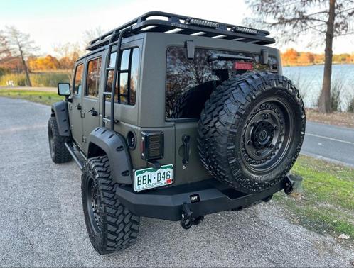 Green 2015 Jeep Wrangler Unlimited Sahara