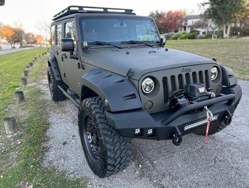 Green 2015 Jeep Wrangler Unlimited Sahara