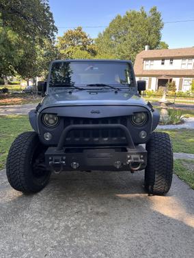 Blue 2015 Jeep Wrangler Unlimited Sahara