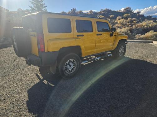 Yellow 2006 Hummer H3 Base