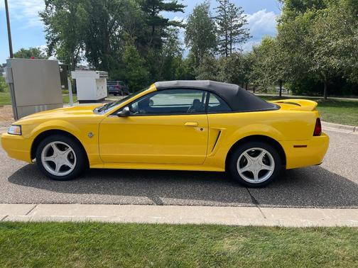 Yellow 1999 Ford Mustang GT