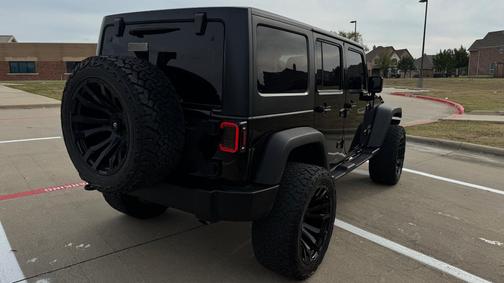 Black 2014 Jeep Wrangler Unlimited Sport