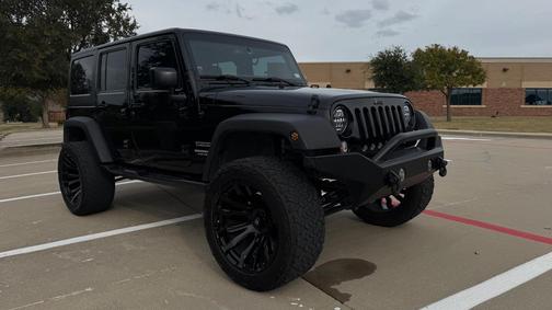 Black 2014 Jeep Wrangler Unlimited Sport