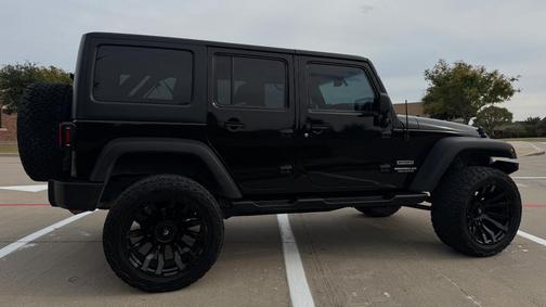 Black 2014 Jeep Wrangler Unlimited Sport