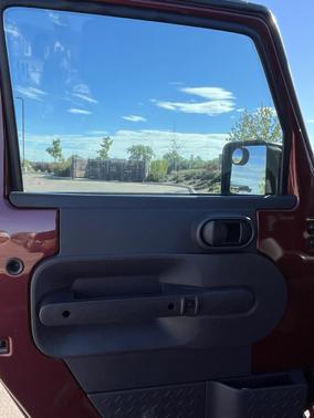 Red 2010 Jeep Wrangler Unlimited Sport
