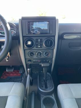 Red 2010 Jeep Wrangler Unlimited Sport