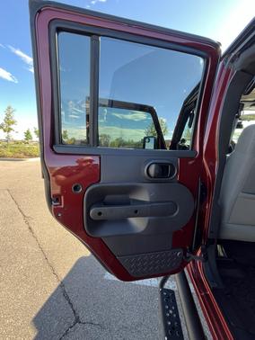 Red 2010 Jeep Wrangler Unlimited Sport