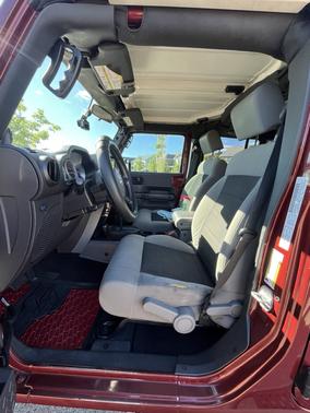 Red 2010 Jeep Wrangler Unlimited Sport