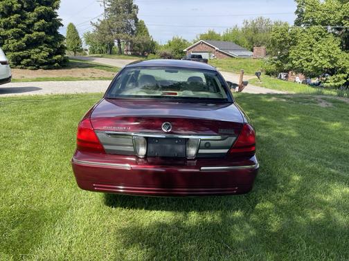 Red 2010 Mercury Grand Marquis LS