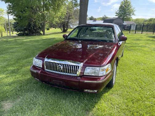 Red 2010 Mercury Grand Marquis LS
