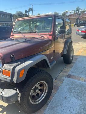 Red 2002 Jeep Wrangler SE