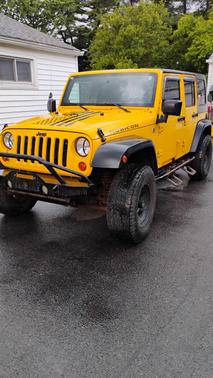Yellow 2009 Jeep Wrangler Unlimited Rubicon