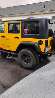 Yellow 2009 Jeep Wrangler Unlimited Rubicon