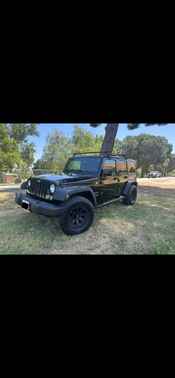 Black 2015 Jeep Wrangler Unlimited Sport