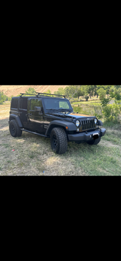 Black 2015 Jeep Wrangler Unlimited Sport