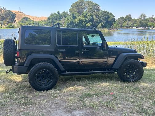 Black 2015 Jeep Wrangler Unlimited Sport