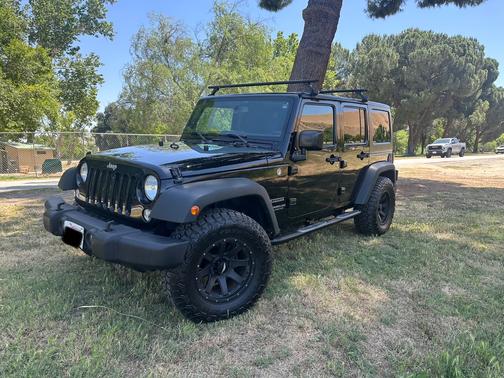 Black 2015 Jeep Wrangler Unlimited Sport
