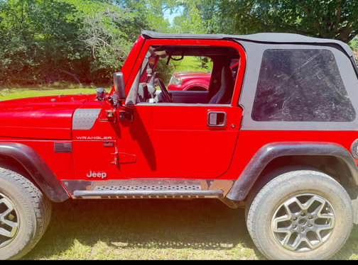 Red 1997 Jeep Wrangler SE