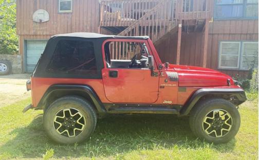 Red 1997 Jeep Wrangler SE
