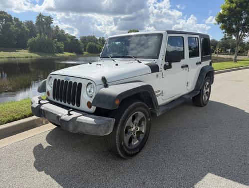 White 2011 Jeep Wrangler Unlimited Sport