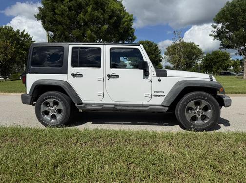 White 2011 Jeep Wrangler Unlimited Sport