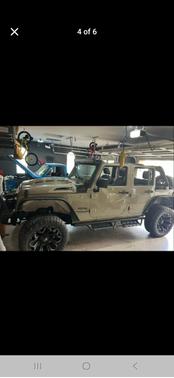 Beige 2017 Jeep Wrangler Unlimited Sport