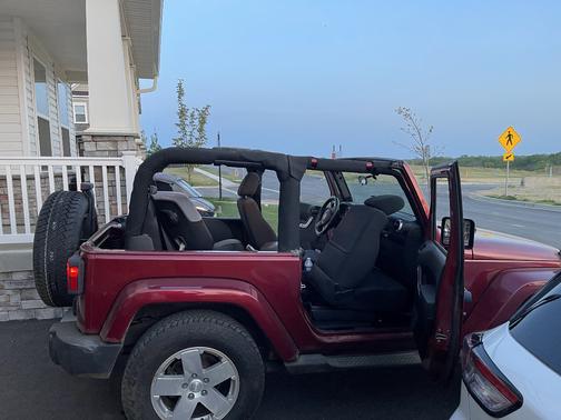Red 2011 Jeep Wrangler Sahara