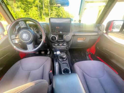 Red 2015 Jeep Wrangler Unlimited Willys Wheeler