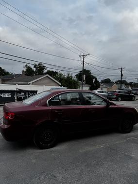 Red 2006 Kia Optima EX