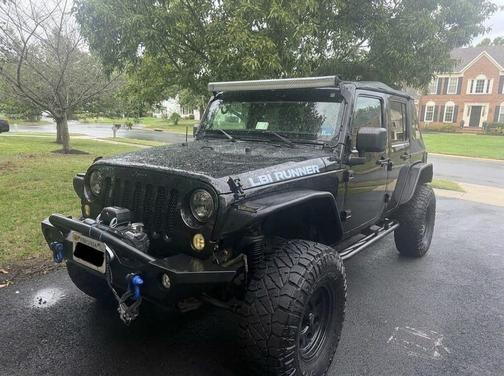 Black 2015 Jeep Wrangler Unlimited Sport