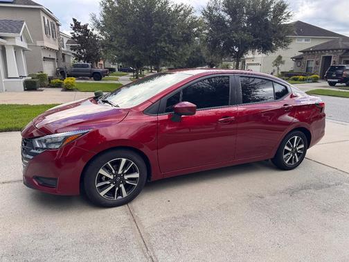 Red 2025 Nissan Versa SV