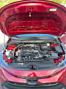 Red 2023 Toyota Corolla LE