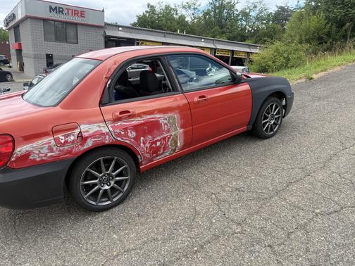 Red 2005 Subaru Impreza 2.5 RS