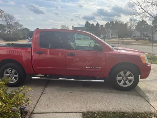 Red 2011 Nissan Titan SV