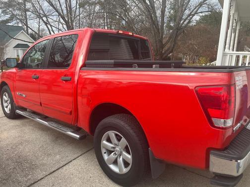 Red 2011 Nissan Titan SV