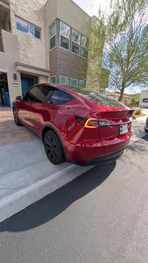 Red 2025 Tesla Model Y Long Range AWD