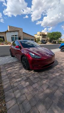 Red 2025 Tesla Model Y Long Range AWD