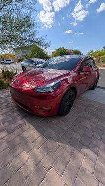Red 2025 Tesla Model Y Long Range AWD