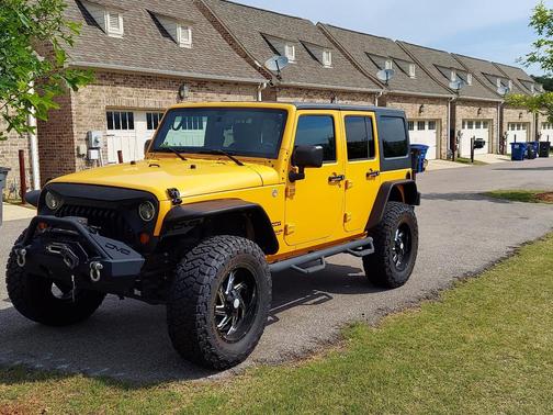 Orange 2013 Jeep Wrangler Unlimited Sport