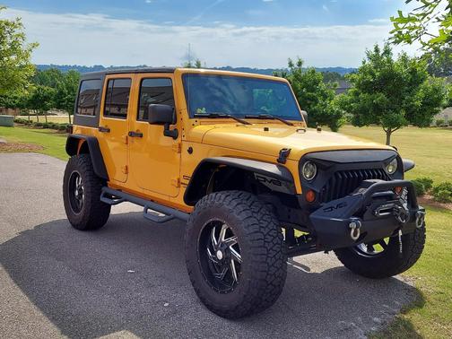Orange 2013 Jeep Wrangler Unlimited Sport