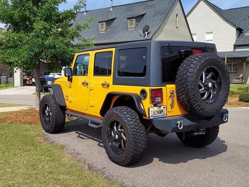 Orange 2013 Jeep Wrangler Unlimited Sport