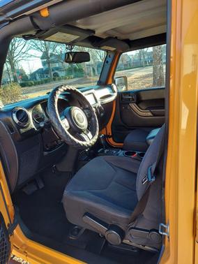 Orange 2013 Jeep Wrangler Unlimited Sport