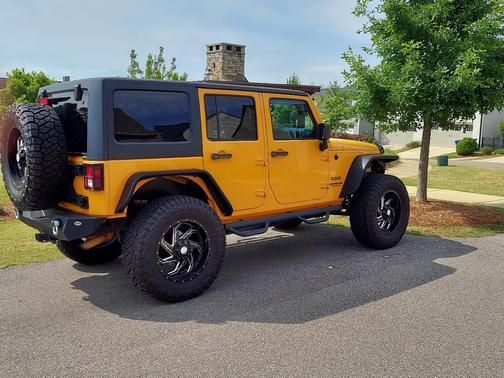 Orange 2013 Jeep Wrangler Unlimited Sport