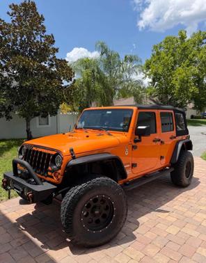 Orange 2013 Jeep Wrangler Unlimited Sport