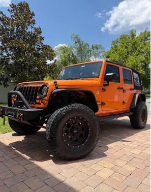 Orange 2013 Jeep Wrangler Unlimited Sport