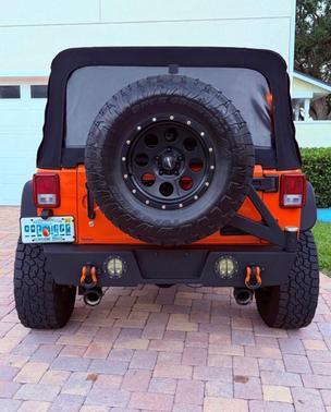 Orange 2013 Jeep Wrangler Unlimited Sport