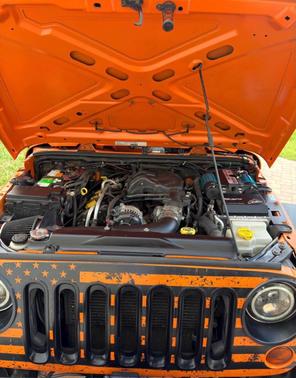 Orange 2013 Jeep Wrangler Unlimited Sport
