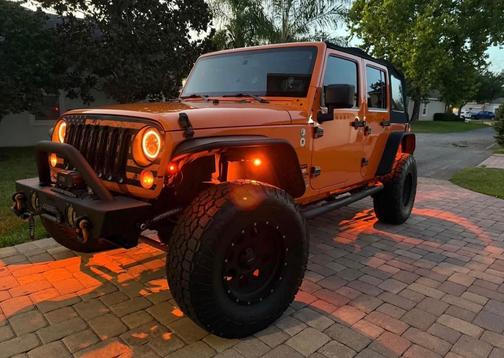 Orange 2013 Jeep Wrangler Unlimited Sport